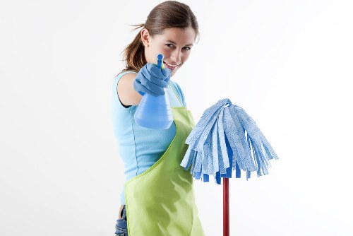 Professional move-in cleaning in an NW2 home with kitchen surfaces being prepared