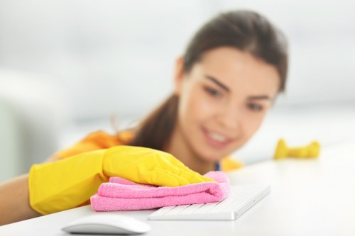 A cleaner maintaining a shared office kitchen in NW2